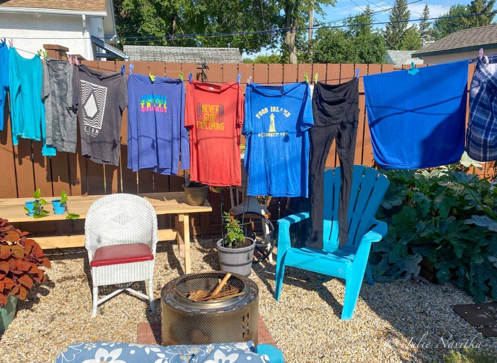 Image of clothes hanging to dry on a line. Hanging your clothes to dry can help you build a more sustainable home.