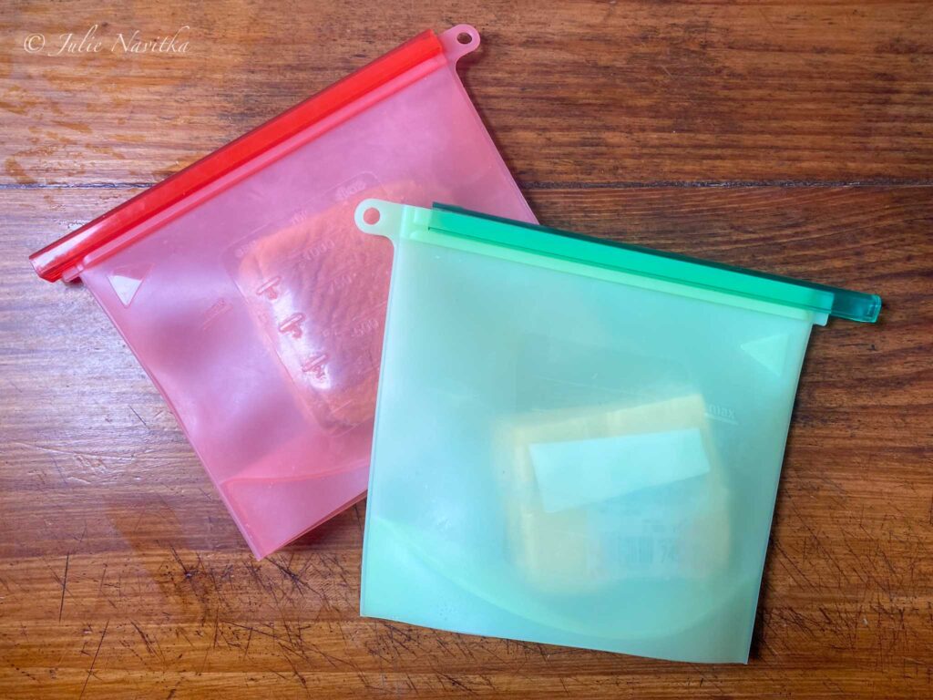 Image of two reusable silicone food bags on a countertop. Reducing our plastic waste can help us lead a more sustainable lifestyle.