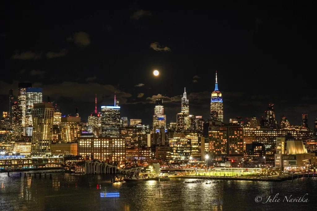 Image of the New York city (Manhattan) skyline at night taken from the Hudson Rifer.