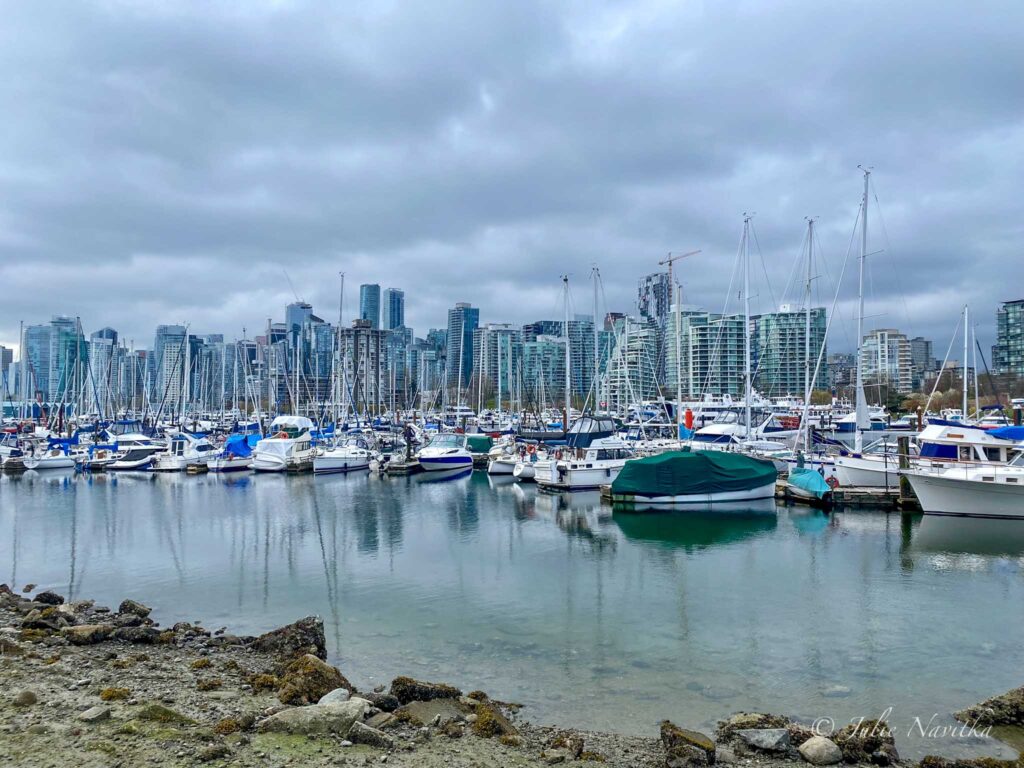 Image of Vancouver skyline over the water near a marina. Vancouver is ranked 17th out of 100 on the Arcadis Sustainable Cities Index 2022.  