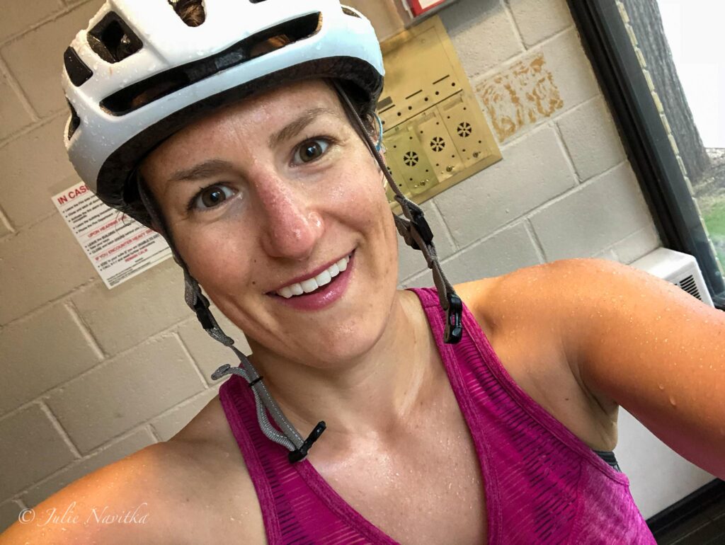 Image of a smiling person wearing a bike helmet. Biking to my school inspired my students to do the same in order to lead a more sustainable lifestyle.