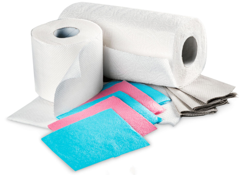 Image of a variety of paper towel rolls and sheets, with a few reusable ones beside. Replacing paper towels in the kitchen with reusable ones saves a lot of water through reduction of water during the manufacturing process.