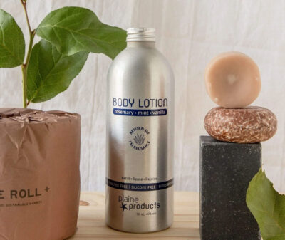 Image of a bottle of Body Lotion from Plaine Products. Plaine offers returns and refills on their bottles, practicing eco-friendly beauty product packaging.