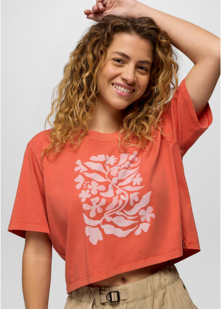 Image of a model wearing a graphic cropped tee made with organic cotton fabric by prAna.