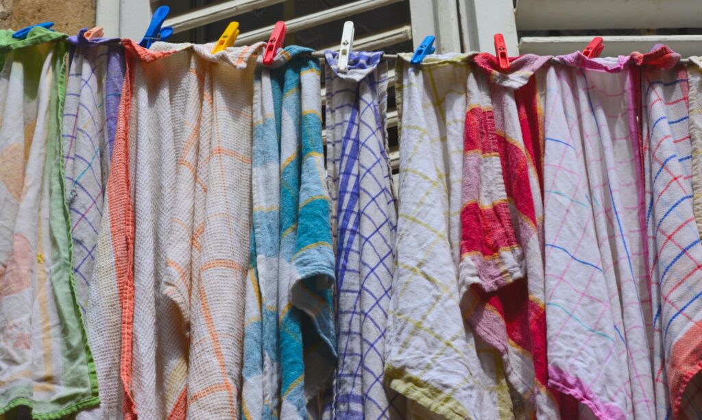 Image of tea towels hanging on a laundry line.
