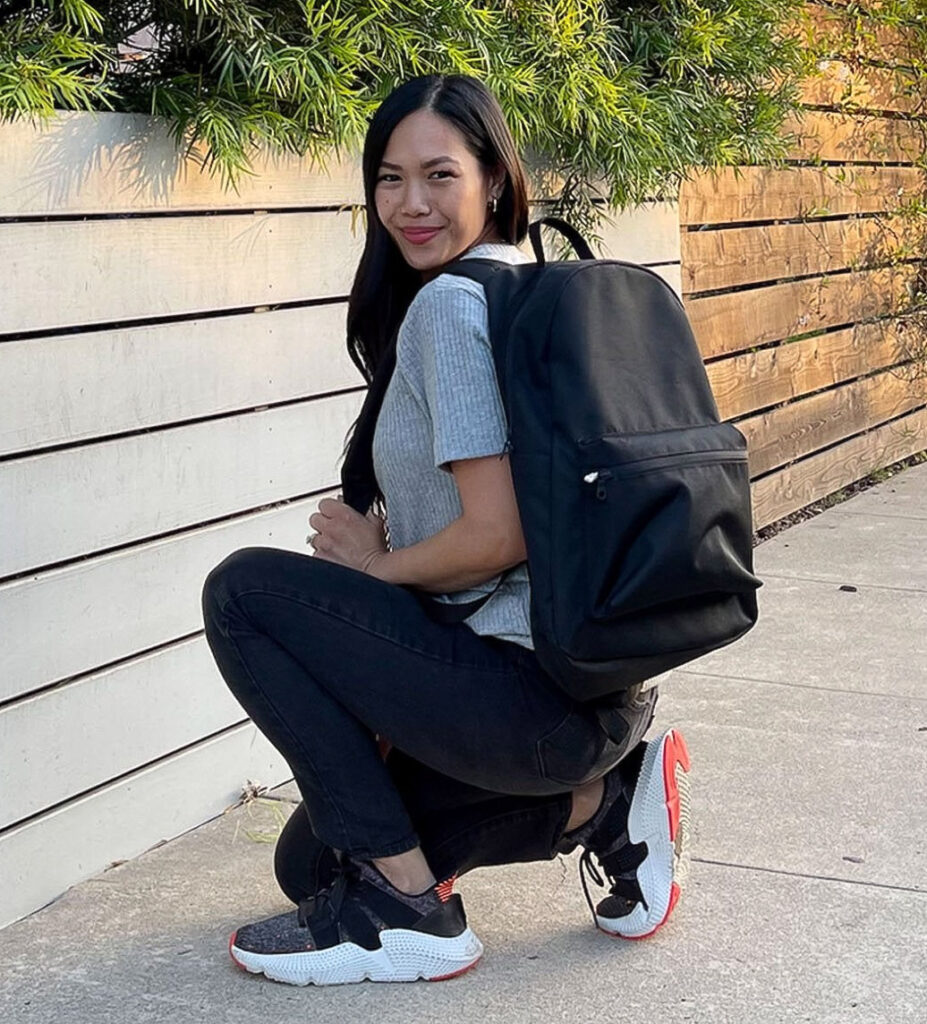 Image of a model wearing the Please Recycle Backpack by Girlfriend Collective