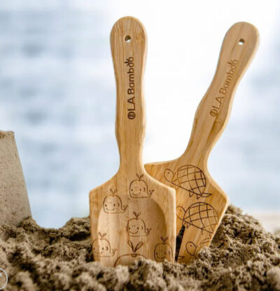 Image of the OLAbamboo sand shovel and rake. Bamboo is a terrific material to make eco-friendly beach toys out of.