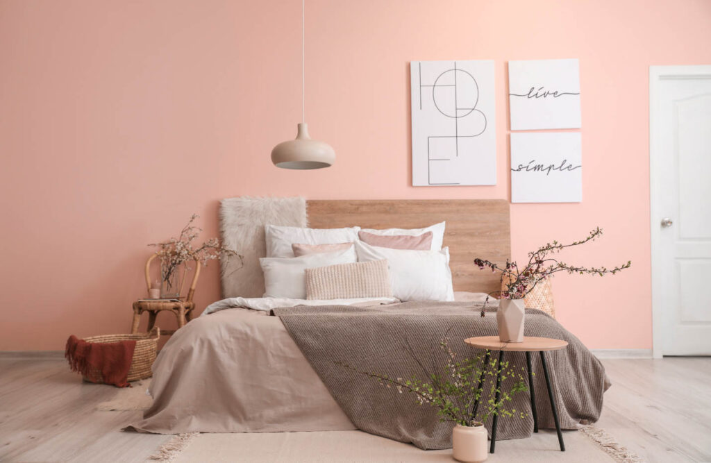 Image of a minimal boho bedroom in a soft pink colour palette.