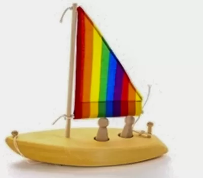Image of the wooden toy sailboat from Our Green House. No set of eco-friendly beach toys is complete without a boat!