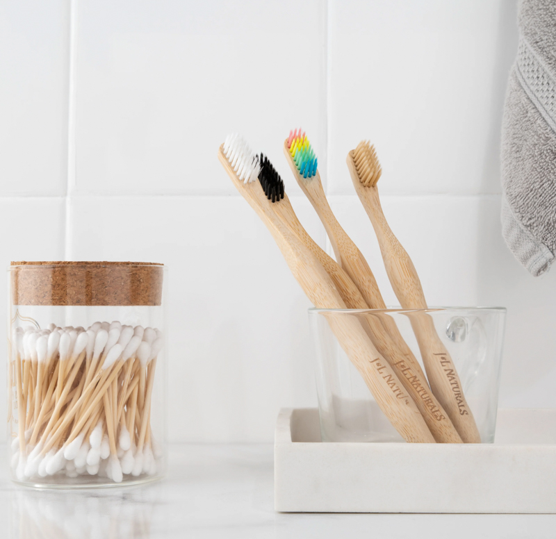 Image of four bamboo toothbrushes by J&L Naturals.