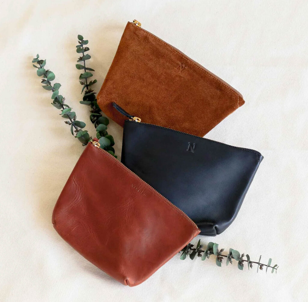 Image of three Rosa Pouches by Nisolo in Earth tones