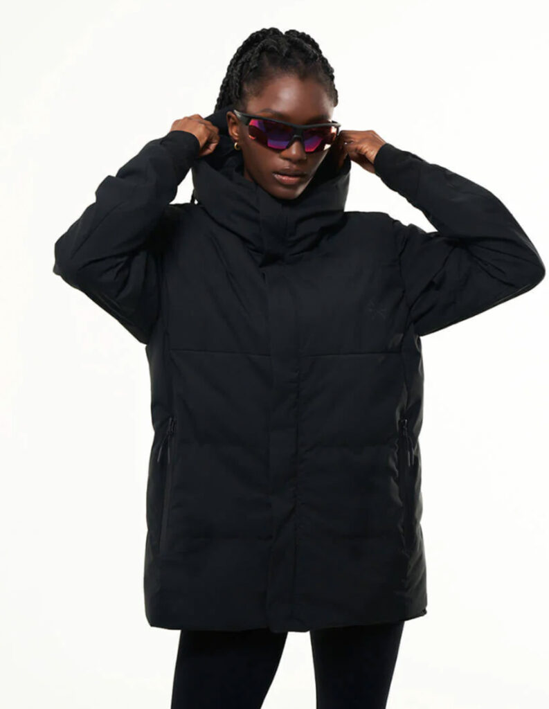 Image of a model wearing the NS60 Jacket from Tropicfeel in Jet Black