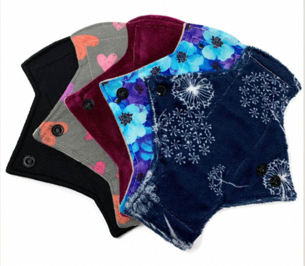 Image of five Tree Hugger Cloth Pads in various patterns.