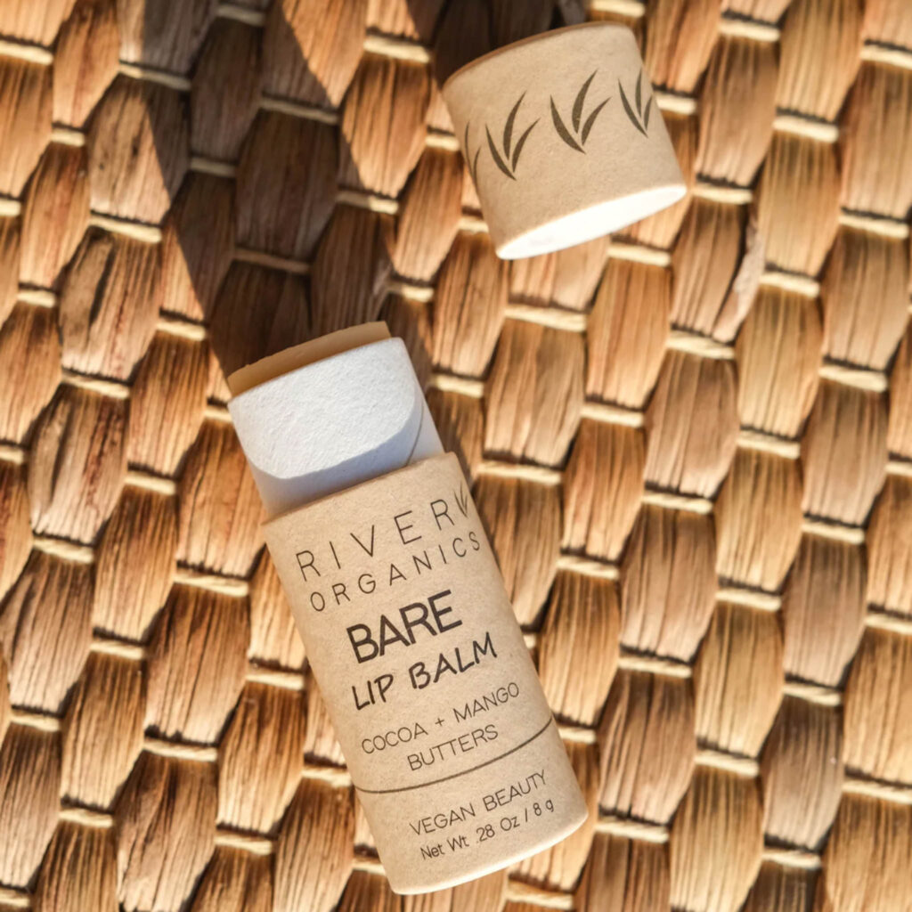 Image of the Vegan Lip Balm by River Organics. The cardboard tube makes this an eco-friendly beauty product package.
