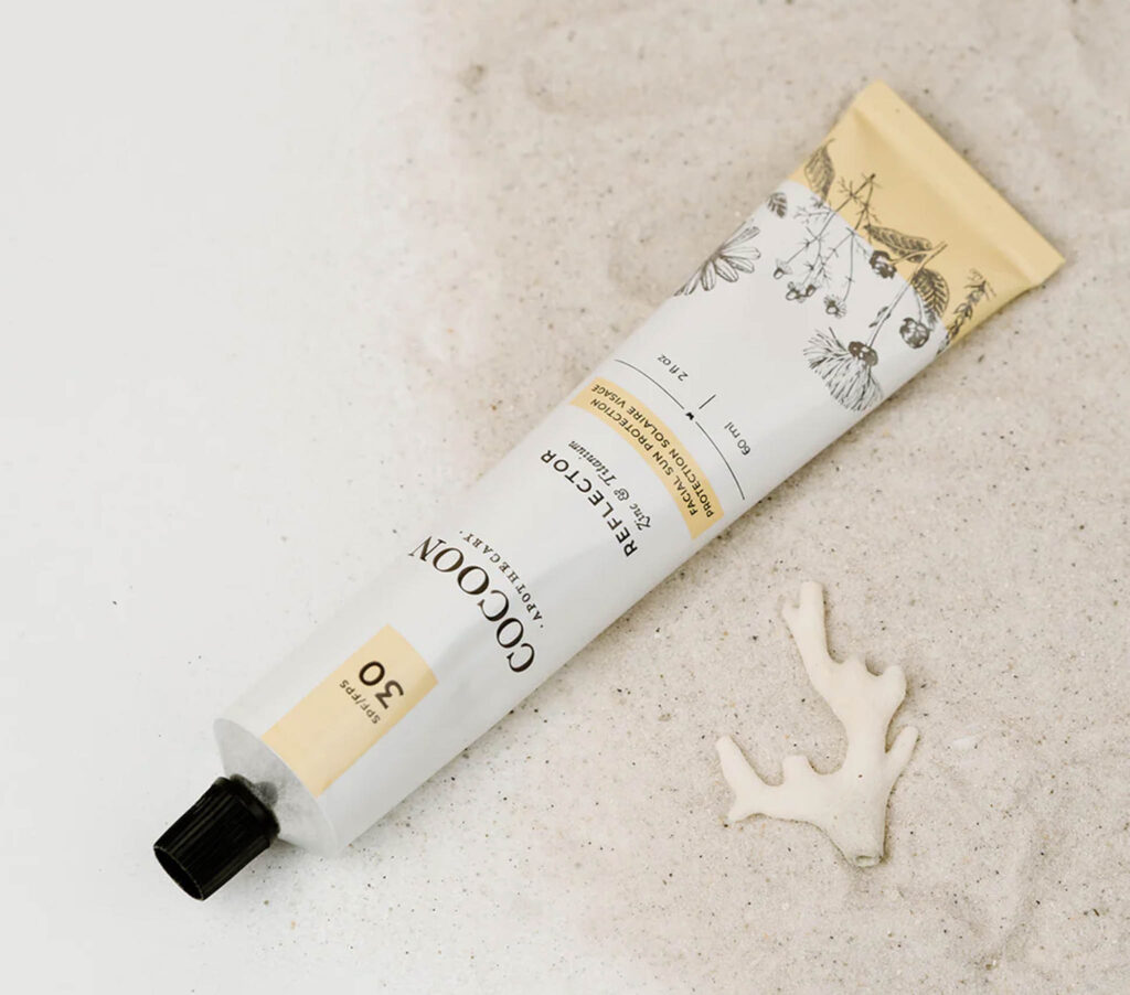 Image of the Reflector SPF 30 Facial Sun Protection from Cocoon Apothecary. Sustainable travel sunscreen should be reef-safe.