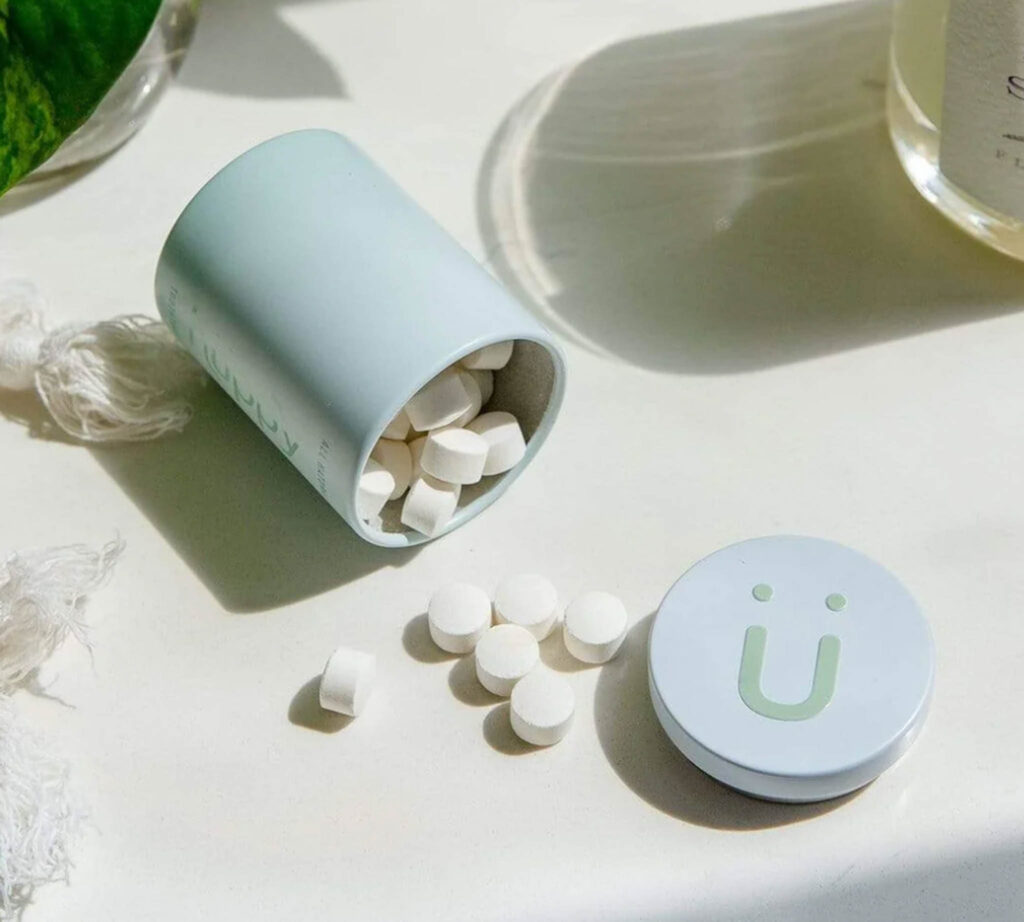 Image of the Toothpaste Tablets by Huppy from the Zero Waste Store. These tabs make a great addition to your sustainable travel toiletries kit!