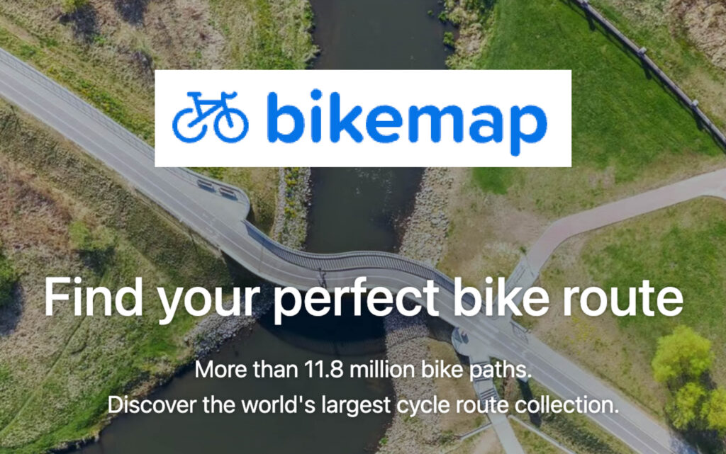 Image of the Bike Map logo on top of a background image of a bridge over a river taken from above. This app for sustainable travel will help you commute in a more eco-friendly manner.