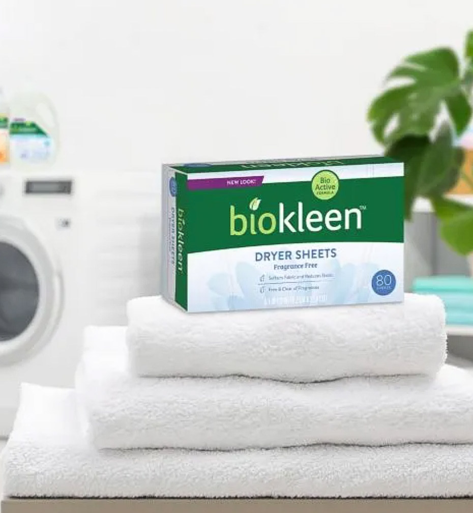 Image of a box of Biokleen dryer sheets on top of three folded white towels.