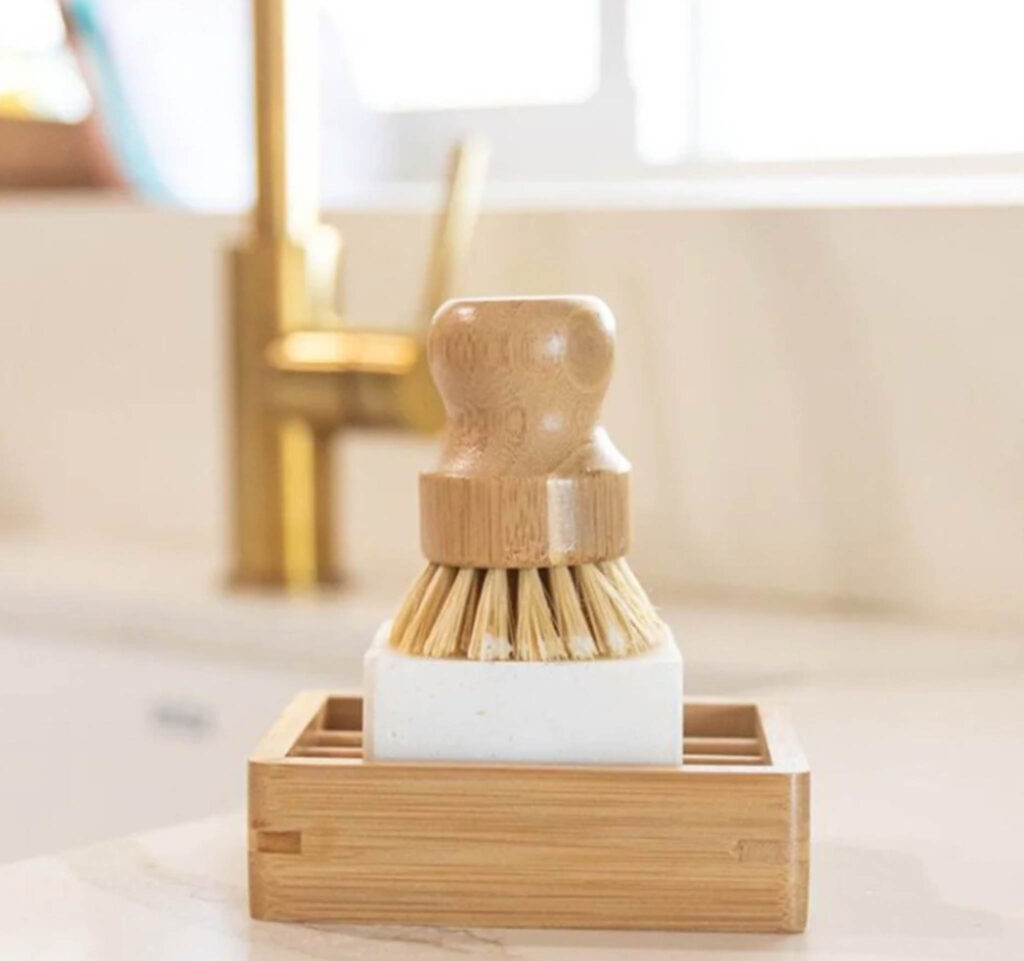 Image of the Bamboo Shelf from No Tox Life with a bar of soap and brush sitting atop.