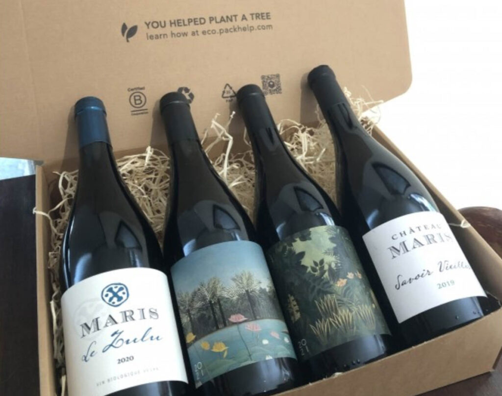 Image of four sustainable wine bottles from Chateau Maris in an open box packaged and ready for purchase.
