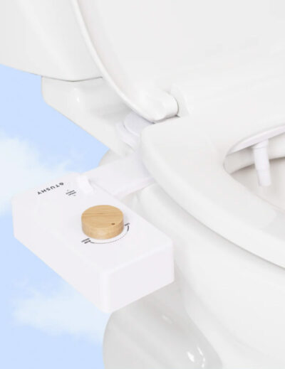 Image of the Tushy 3.0 bidet attachment with bamboo turn dial.