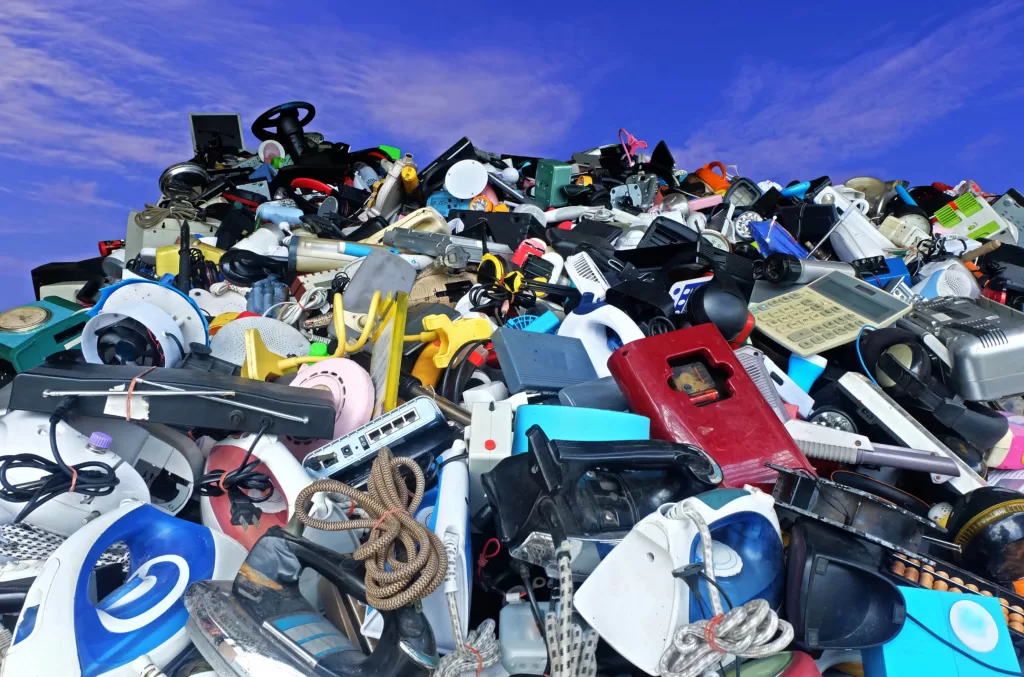 Image of a towering pile of discarded electronics.