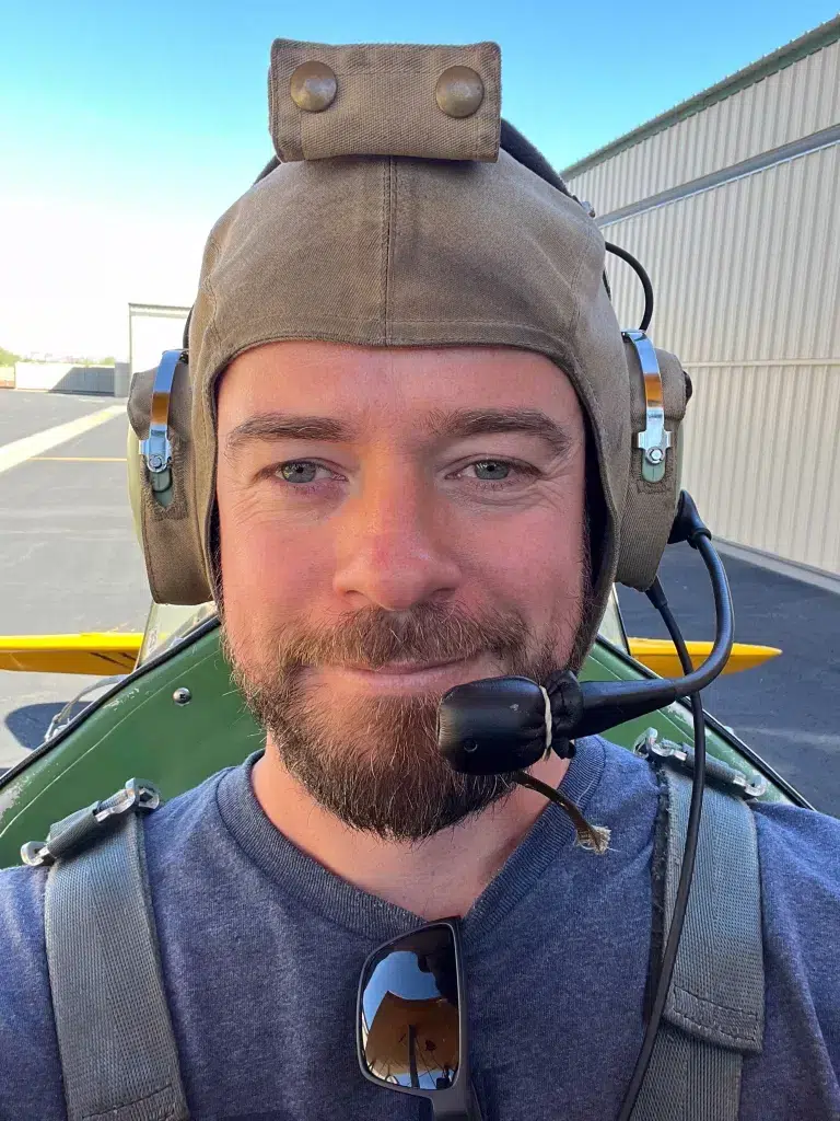 Image of the website SEO specialist in an open cockpit airplane.