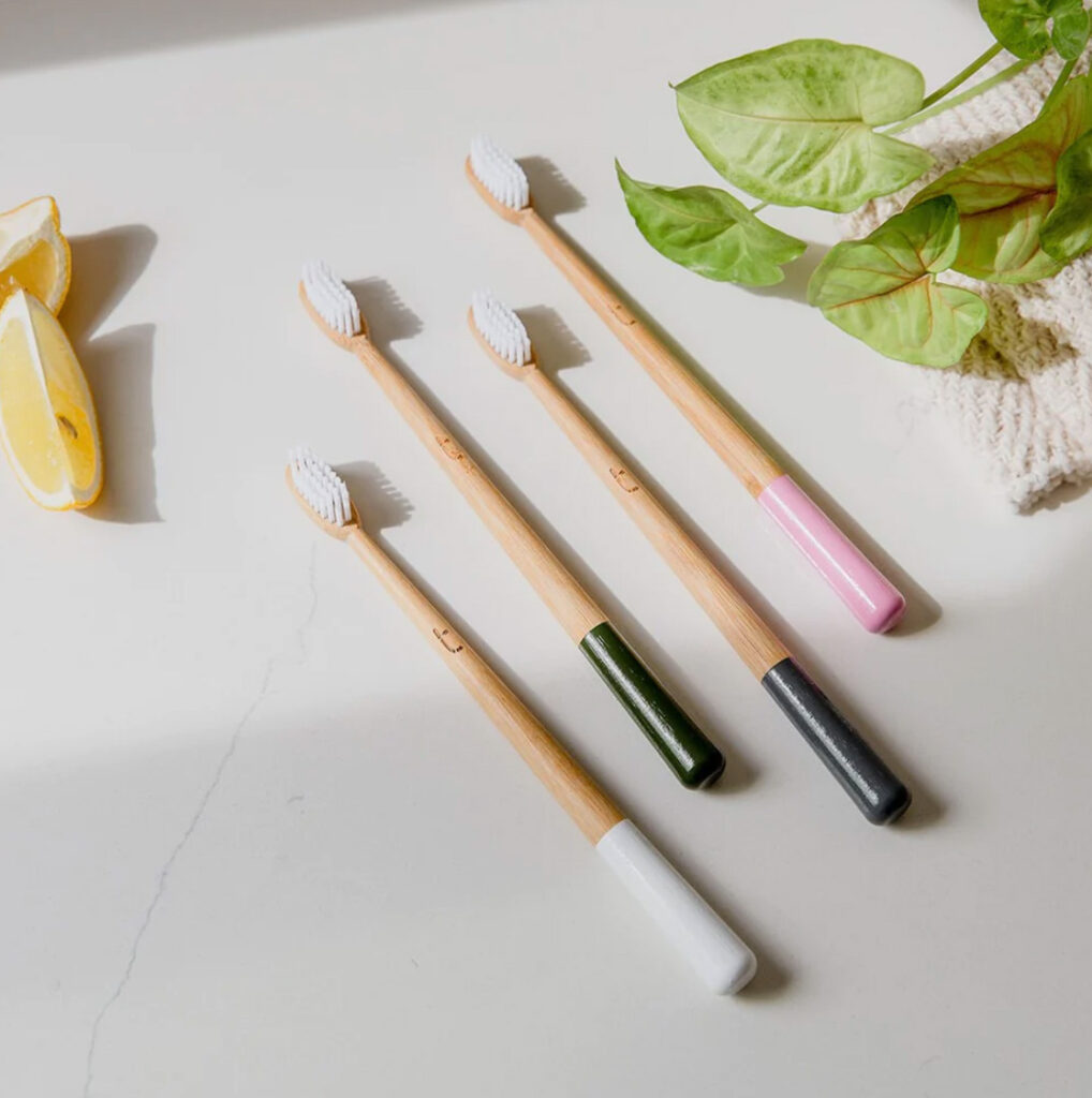 Image of 4 painted bamboo toothbrushes by truthbrush