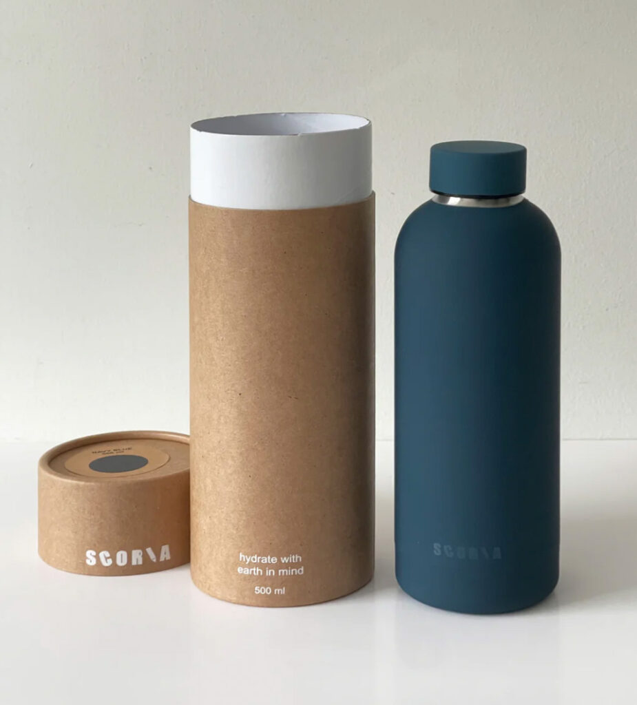 Image of the stainless steel Insulated Water bottle by Scoria next to the cardboard tube it comes packged in.