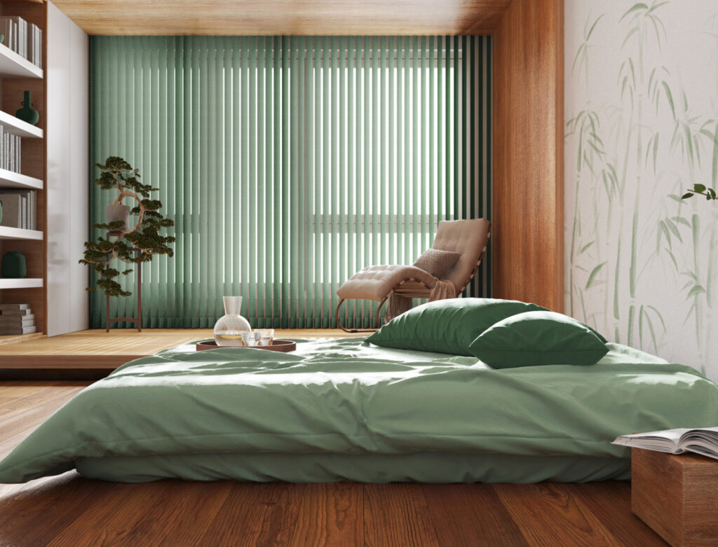 Image of a simple bedroom with wooden floors.