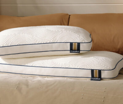 Image of two pillows sitting on a bed from Parallel.