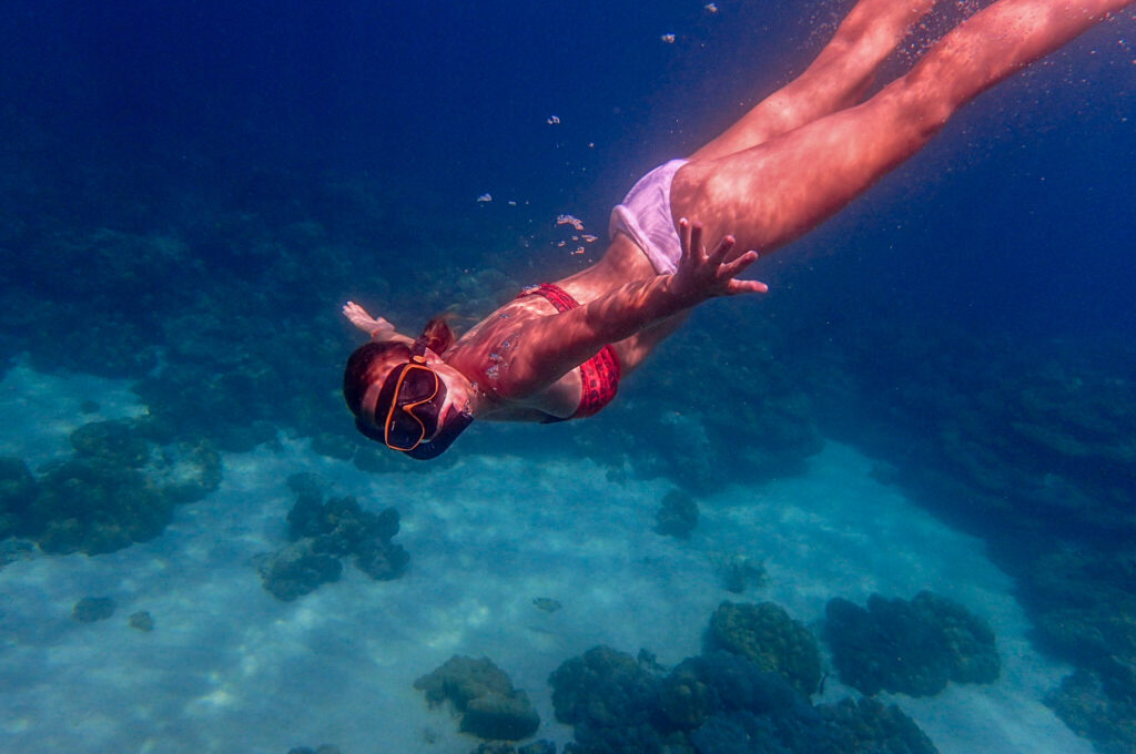 Image of a snorkeler taken underwater.
