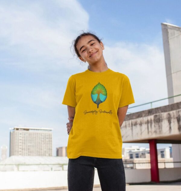 Image of a model wearing the Successfully Sustainable Kids Tee in Mustard.