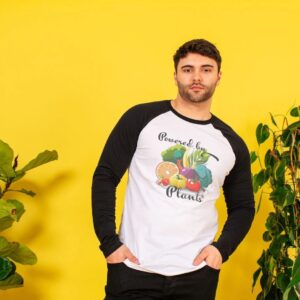 Image of a model wearing the Powered by Plants Baseball Tee