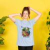 Image of a model wearing the Powered by Plants Tee in Sky Blue