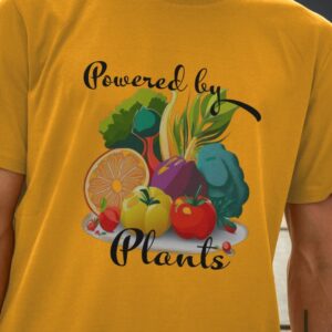 Image of a model wearing the Powered by Plants Tee in Mustard