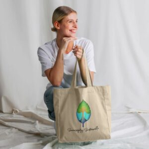 Image of a model holding the Successfully Sustainable tote bag.