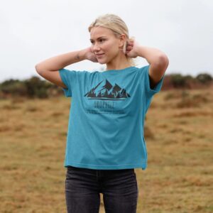 Image of a model wearing the Mountain Lover Tee in Ocean Blue.