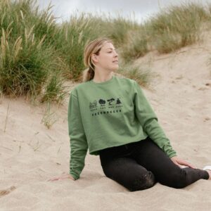 Image of a model wearing the Treehugger Boxy Sweater in Sage Green