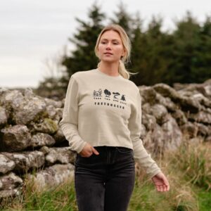 Image of a model wearing the Treehugger Boxy Sweater in Oat