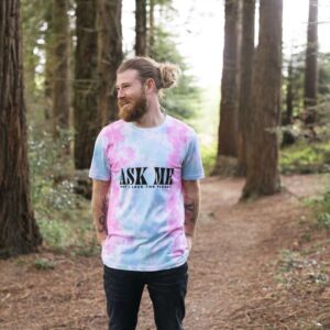 Image of a model wearing the tie-dyed Planet Lover Tee