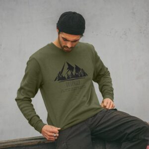 Image of a model wearing the "Mountain Lover Crewneck" in Sage.